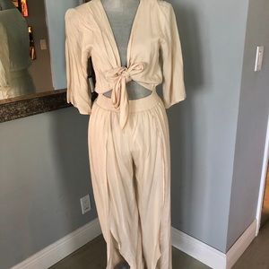New with tags. Tan and white -boho chic jumpsuit